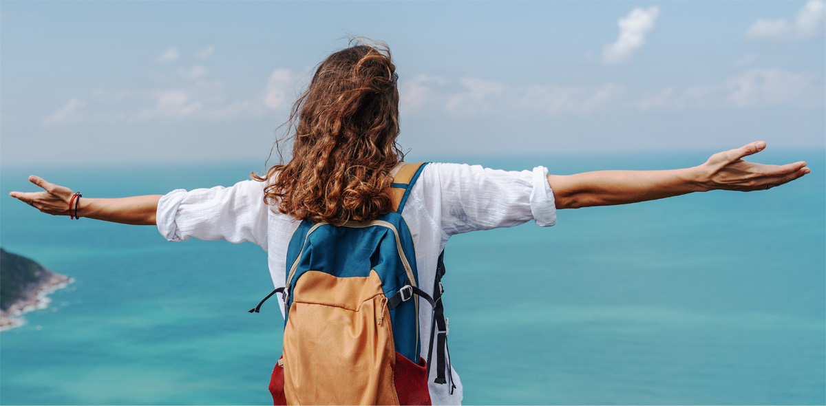 woman enjoying a beautiful view of the ocean